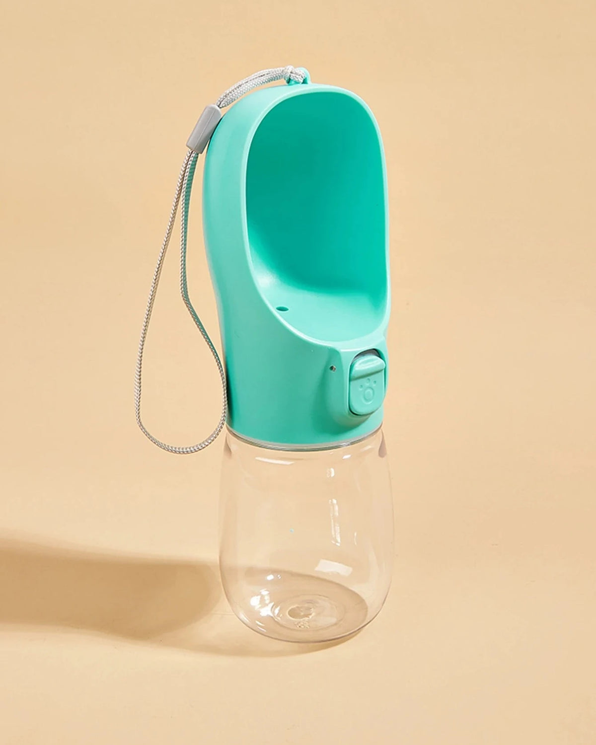 The Long Walk Water Bottle in turquoise with wrist strap on a cream background