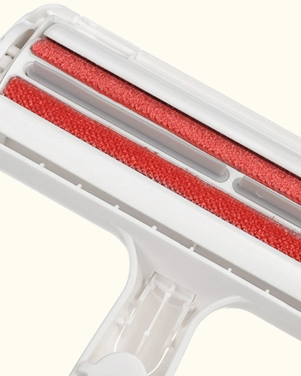 Close-up of the red brush strips on The Aftermath Hair Remover