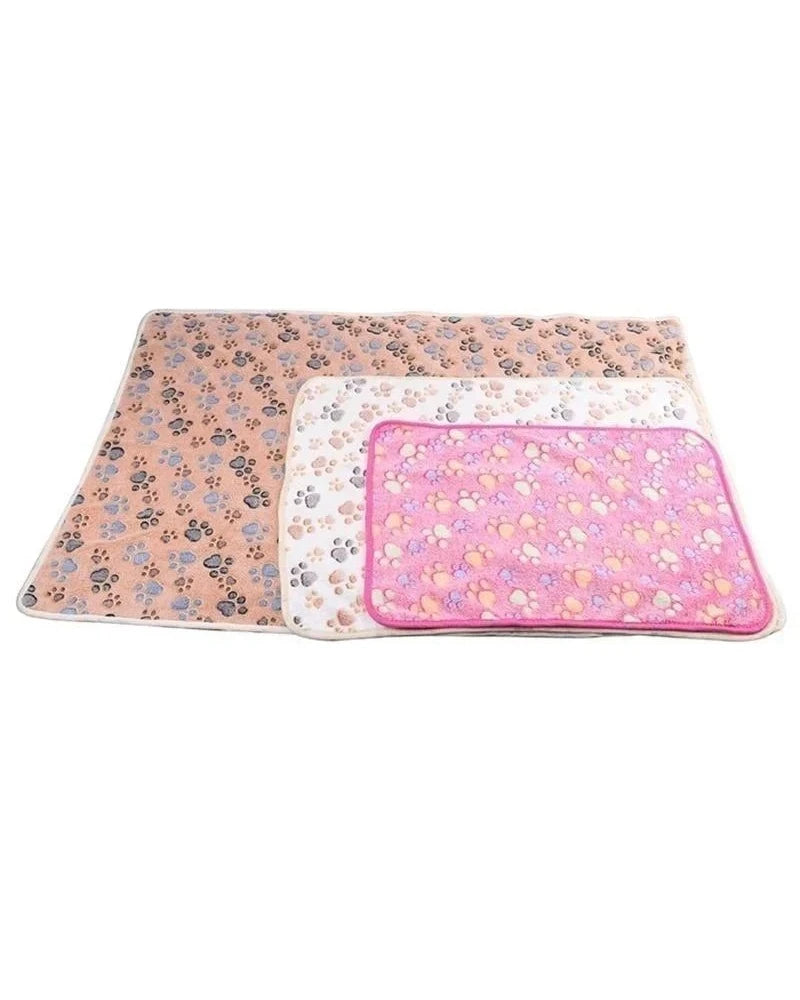 The Sunday Blanket in three sizes laid flat, largest at the back