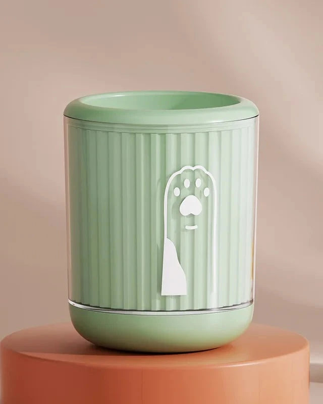 The Dalewood Paw Cleaner in green on a terracotta plinth