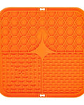 The Slow Sunday Lick Mat in orange on a white background