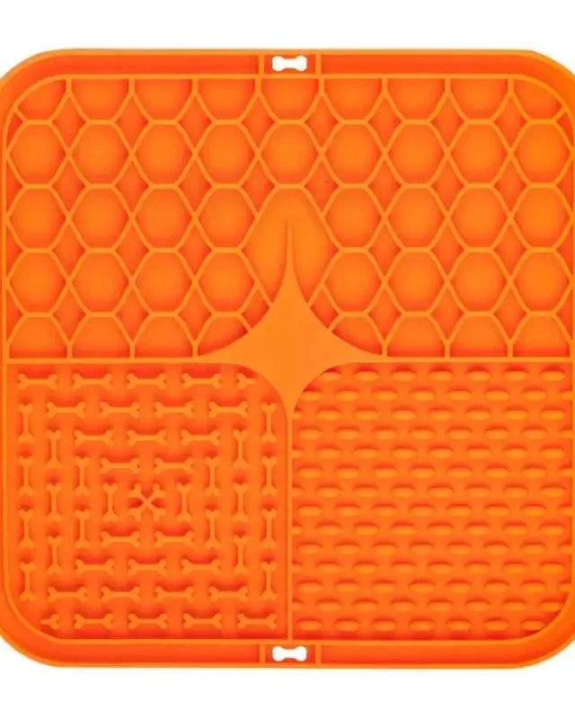 The Slow Sunday Lick Mat in orange on a white background