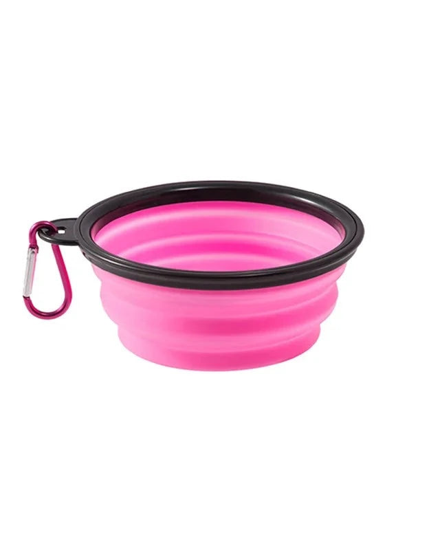 The Fold-Flat Bowl in pink with carabiner on a white background