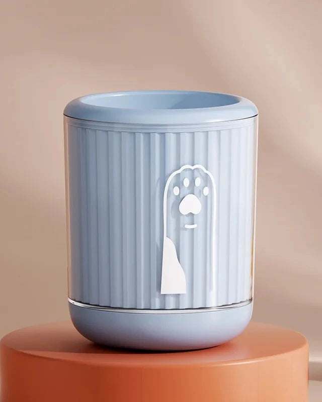 The Dalewood Paw Cleaner in blue on a terracotta plinth