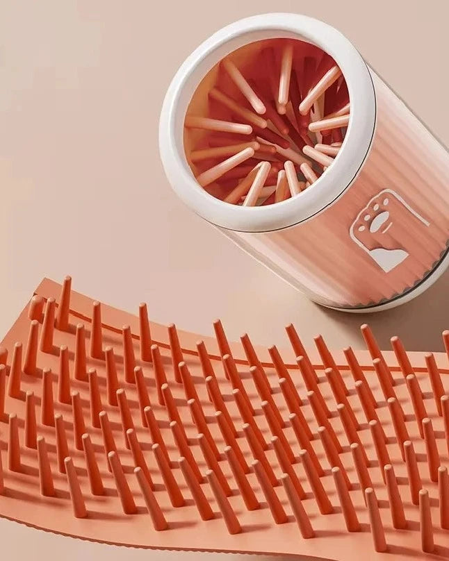 The Dalewood Paw Cleaner in orange with its silicone bristle insert removed