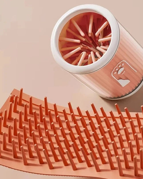 The Dalewood Paw Cleaner in orange with its silicone bristle insert removed