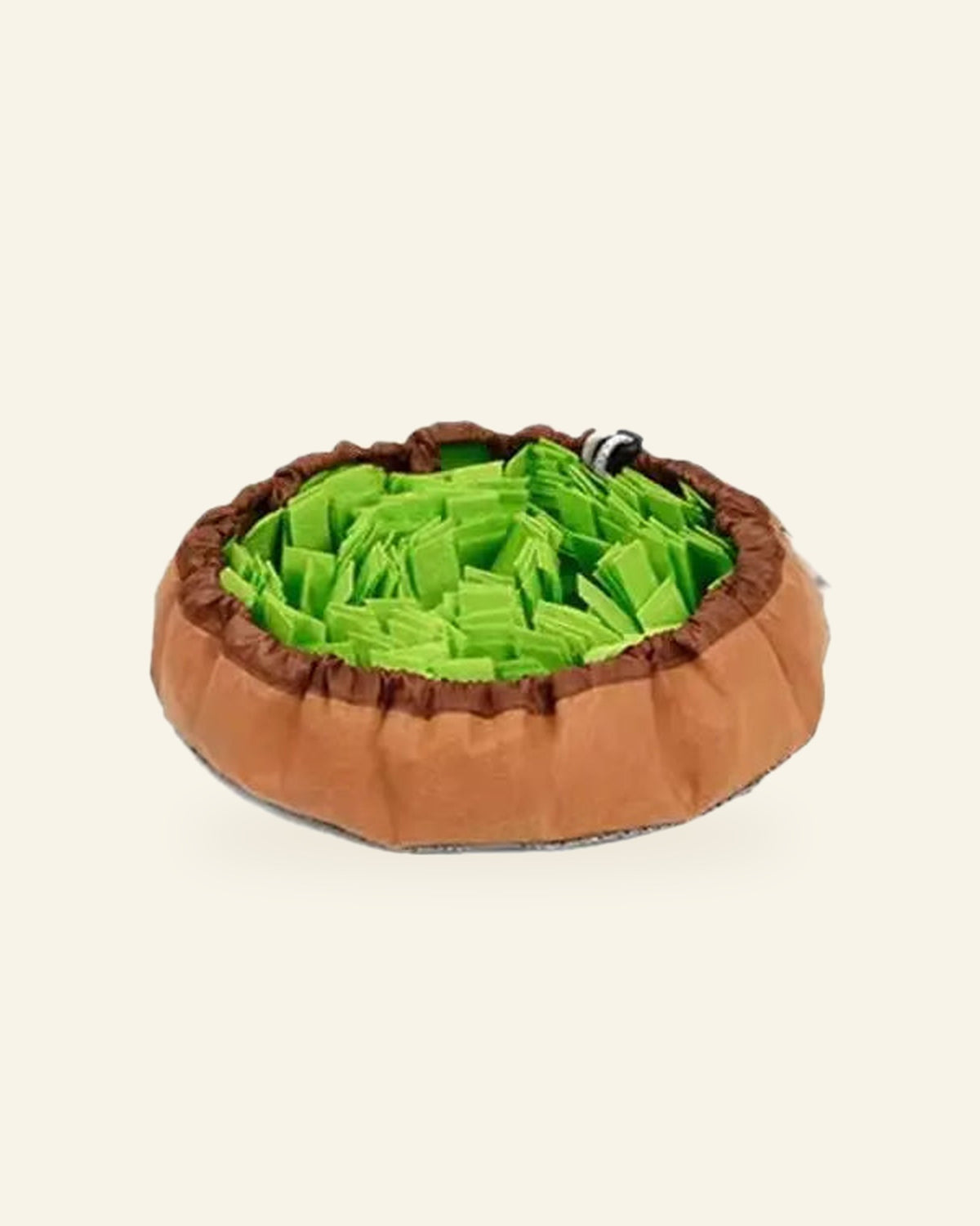 The Field Day Snuffle Mat in green, drawstring pulled into a bowl